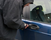 Man breaking into a car